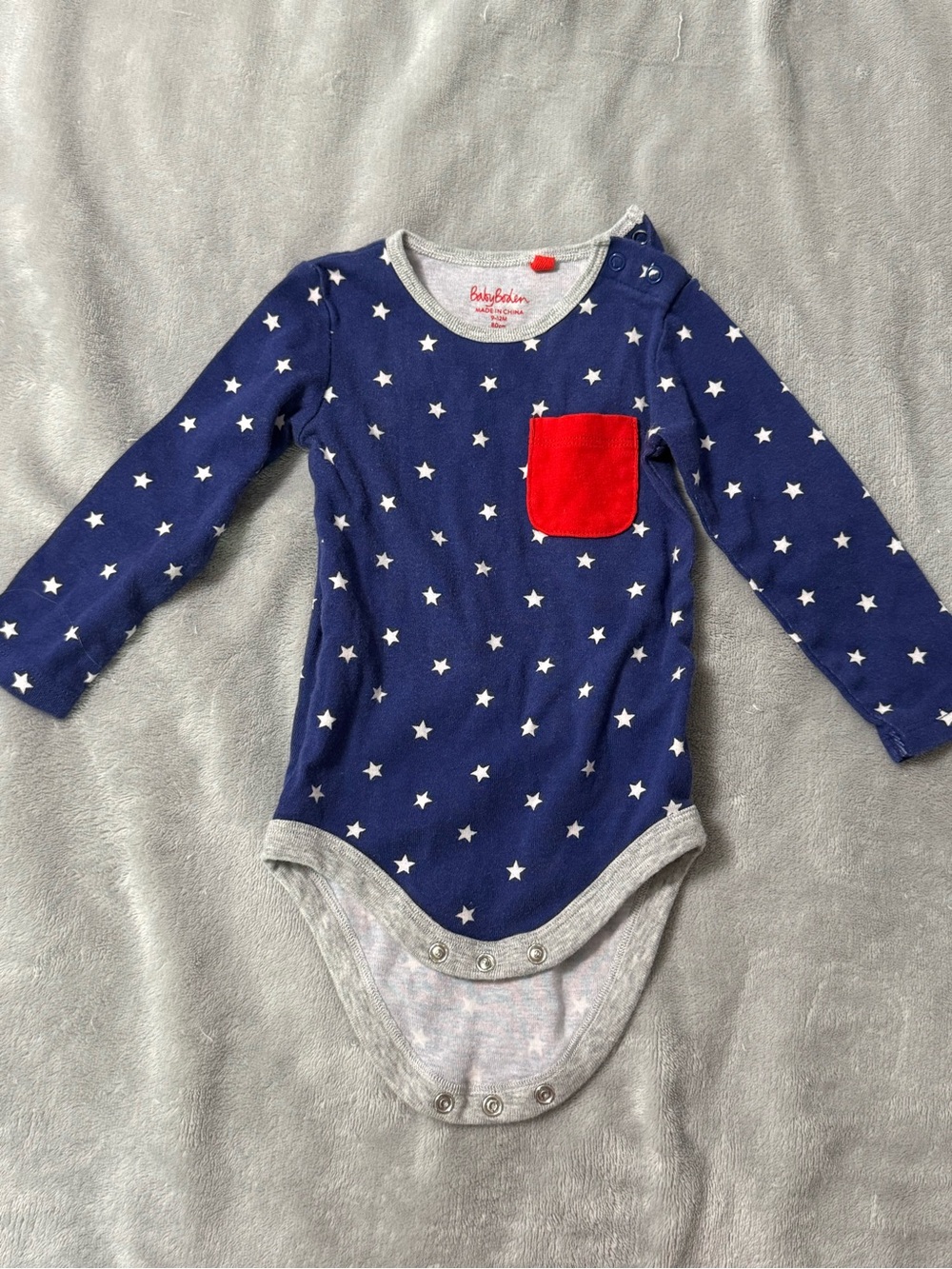 Baby Boden Navy Star Long-Sleeve Bodysuit with Red Pocket